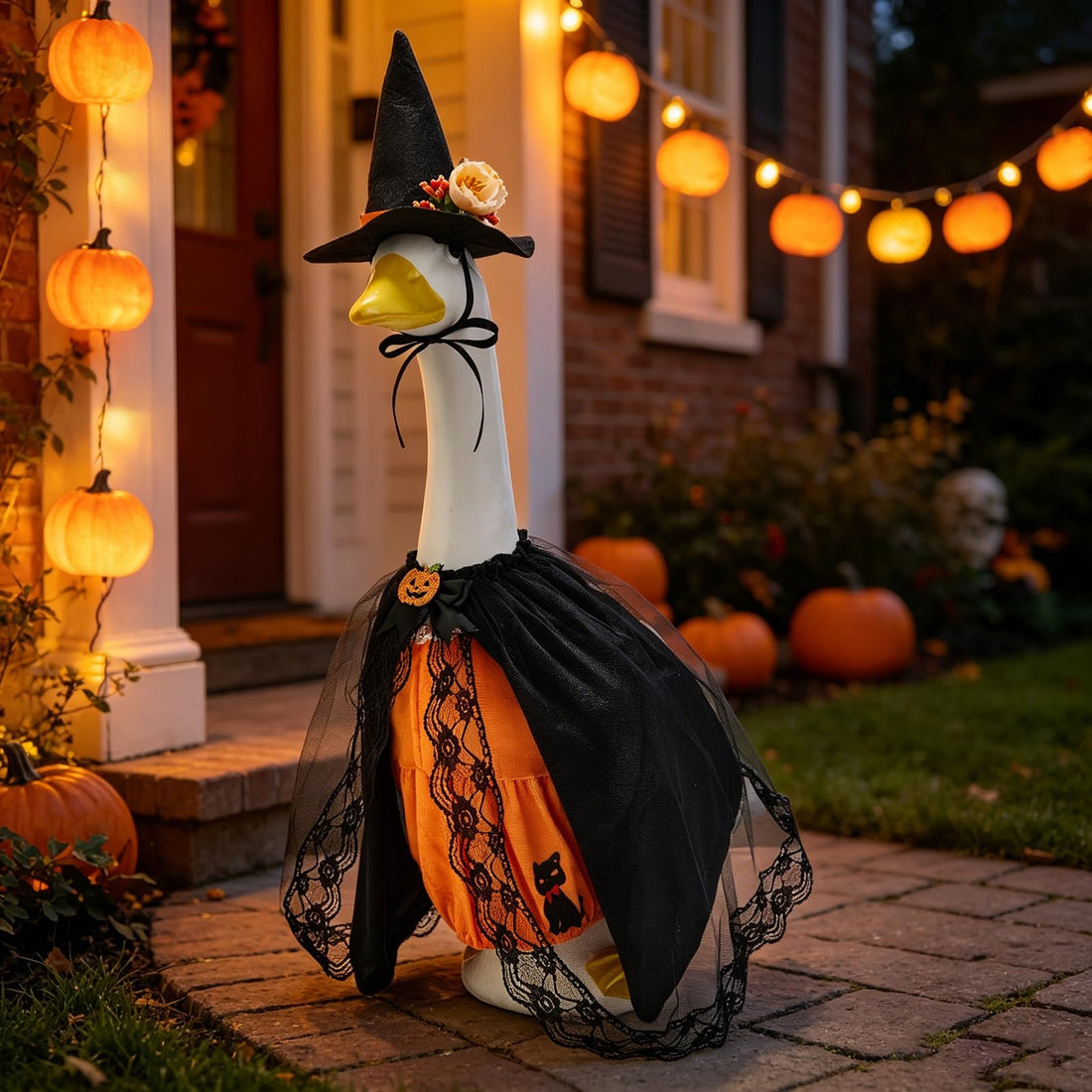 Halloween decorated front porch with dressed lawn goose, animatronic Grim Reaper, and pumpkins